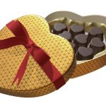 Heart shaped box with chocolate and red bow