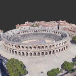 Arenes De Nimes 3d Model - Detailed 3D model of the Arenes de Nimes Roman amphitheater, showcasing its historical architecture and textures under clear skies.