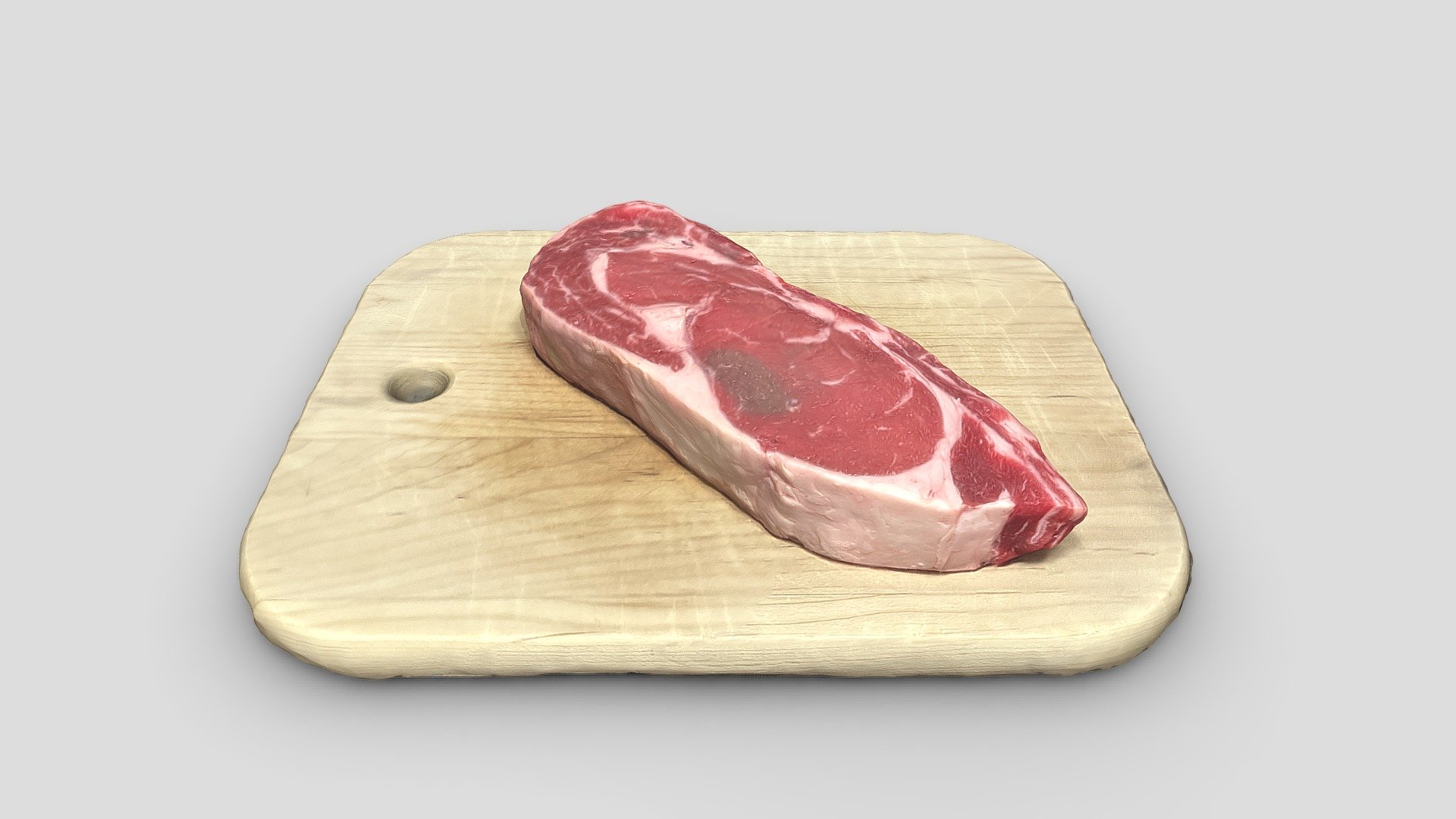 Boneless Ribeye steak on chopping board