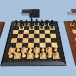 Three different wooden chess pieces and boards